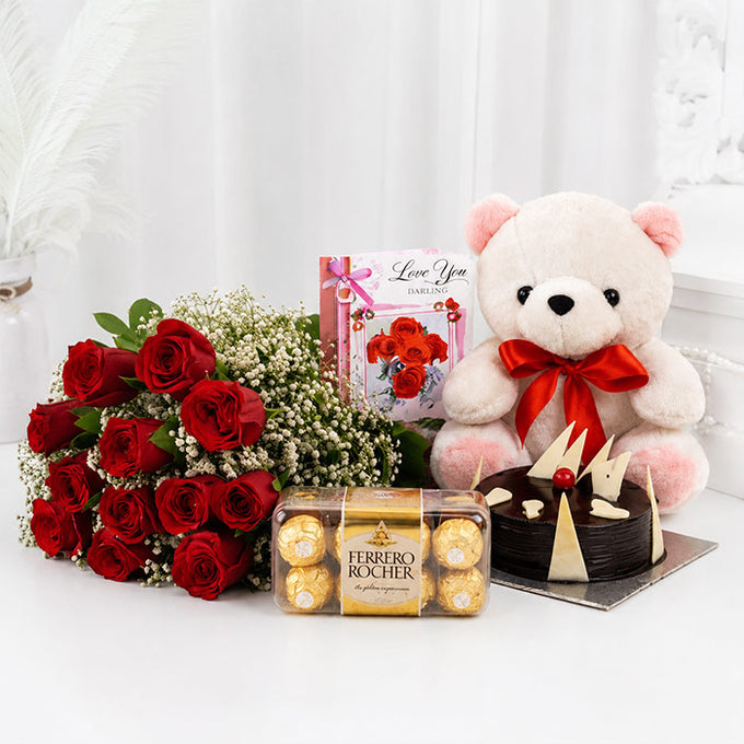 12 Red Roses Bouquet with Half Kg Chocolate Cake, 16 Ferrero Rocher & 6 Inch Teddy
