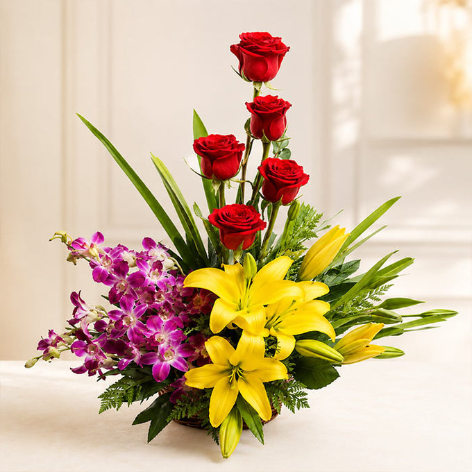 Red Roses, Purple Orchids & Yellow Asiatic Lilies Basket Arrangement - Flower Delivery in GiftsGhaziabad
