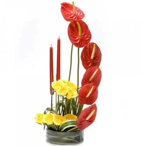 Red Anthuriums with 12 Yellow Roses in Glass Vase & Candles - Flower Delivery in GiftsGhaziabad