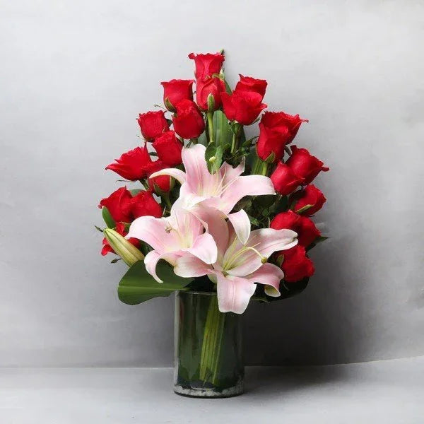 20 Red Roses & 3 Pink Asiatic Lilies Glass Vase - Flower Delivery in GiftsGhaziabad