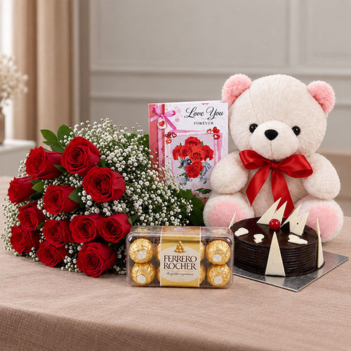 12 Red Roses Bouquet with Half Kg Chocolate Cake, 16 Ferrero Rocher & 6 Inch Teddy