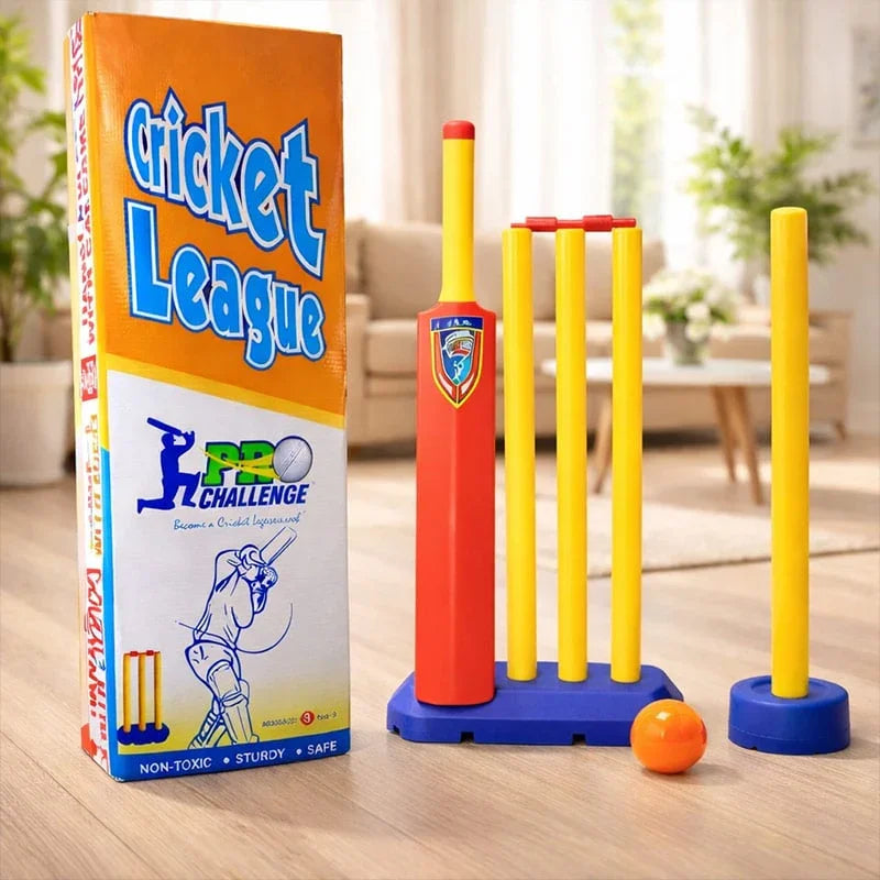 Children's cricket set with 'Cricket League' packaging on a wooden floor.
