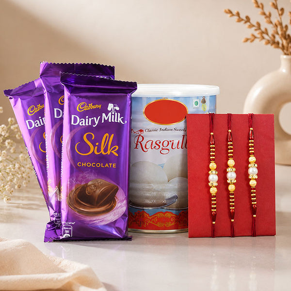 3 Dairy Milk Silk Chocolates with 1 Kg Rasgulla & 3 Rakhi Gift Set