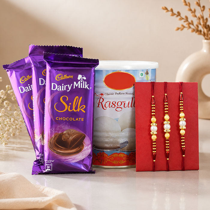 3 Dairy Milk Silk Chocolates with 1 Kg Rasgulla & 3 Rakhi Gift Set