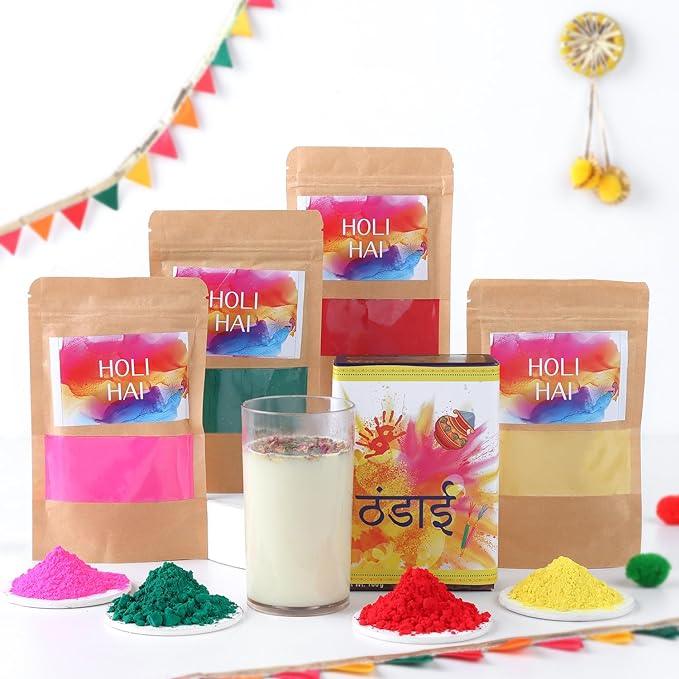 Holi color powder packages with a glass of milk and colorful powders on a white background.