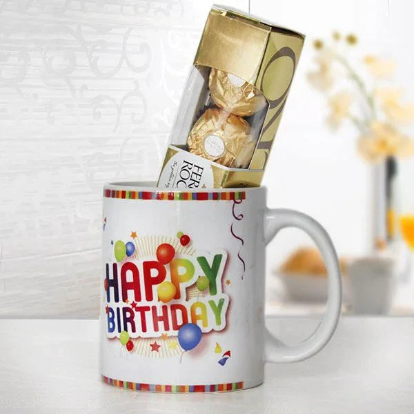 White mug with 'Happy Birthday' text and Ferrero Rocher chocolates on a white background