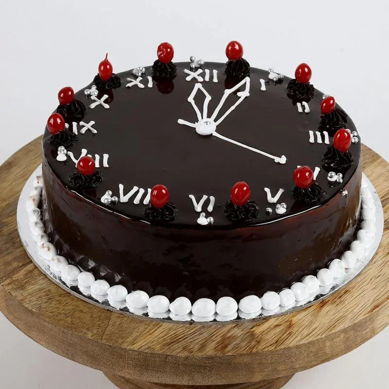 Chocolate cake with clock face decoration on a wooden stand