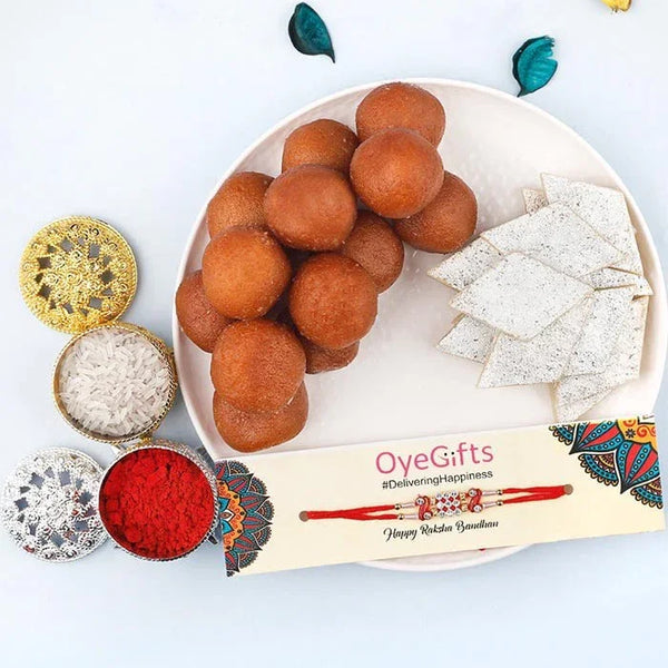 Plate of fried snacks with white items and red powder, branded 'Oye Gifts' on a white background.