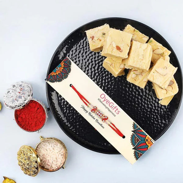 Oye! Gifts box with a black plate of yellow candy on a white background