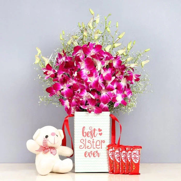 Bouquet of pink flowers with a white box and teddy bear on a light gray background