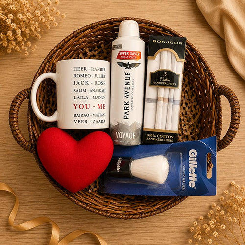 Gift basket with mug, Park Avenue cologne, Gillette product, and heart-shaped item on a wooden surface.