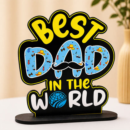 Decorative sign with 'Best Dad in the World' text on a stand.