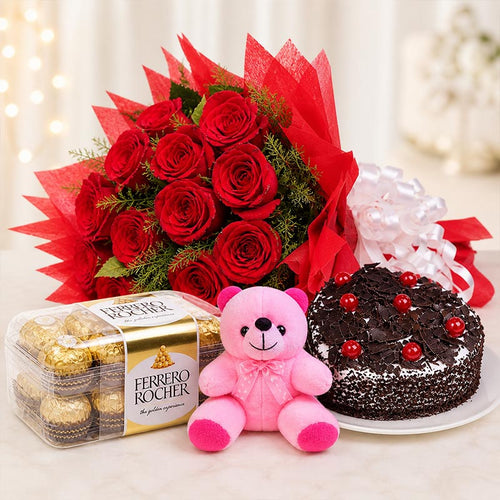 Bouquet of red roses, Ferrero Rocher chocolates, pink teddy bear, and chocolate cake on a table.