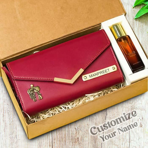 Red wallet with gold accents and a bottle of perfume in a box, featuring the brand 'Manpreet'.