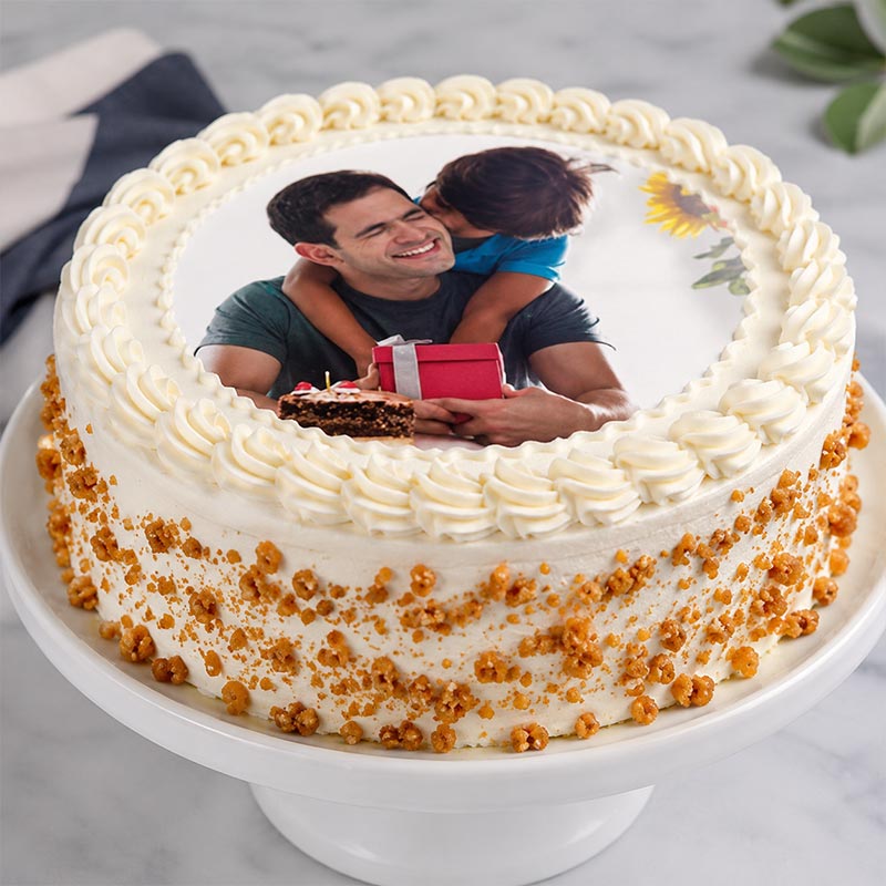 Personalized cake with a photo of a man and child on top