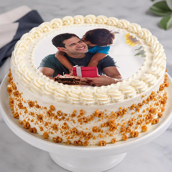 Personalized cake with a photo of a man and child on top