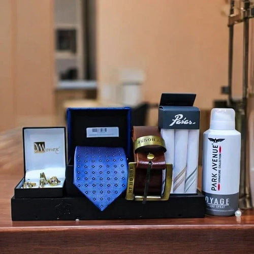 Men’s gift set with cufflinks, blue tie, brown belt, socks, and Park Avenue deodorant