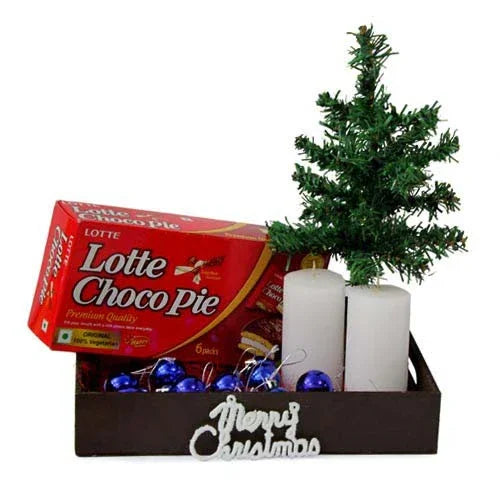 Christmas gift hamper with artificial tree, Lotte Choco Pie, white candles, and blue ornaments