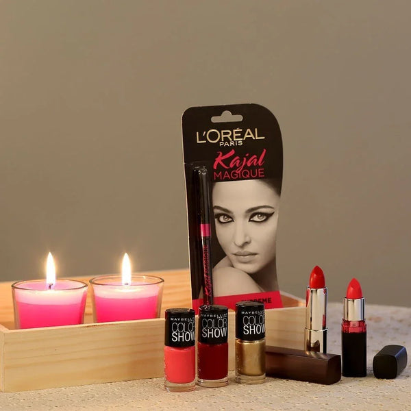 Makeup gift set with kajal, pink candles, nail polish, and red lipstick displayed