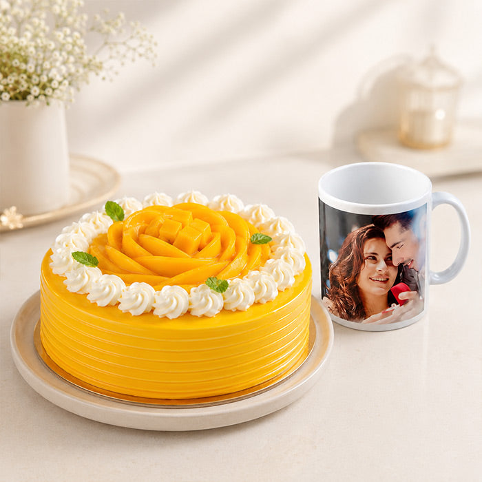 Yellow cake with white frosting rose and a mug with a photo of a couple on a light background