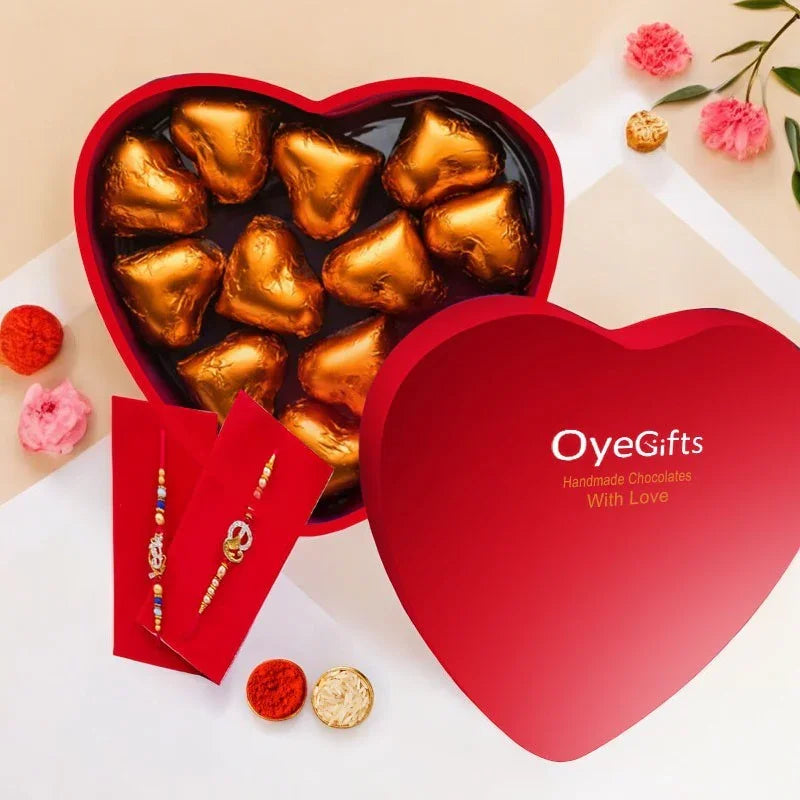 Heart-shaped box of gold chocolate hearts with 'Oye Gifts' branding on a beige background.