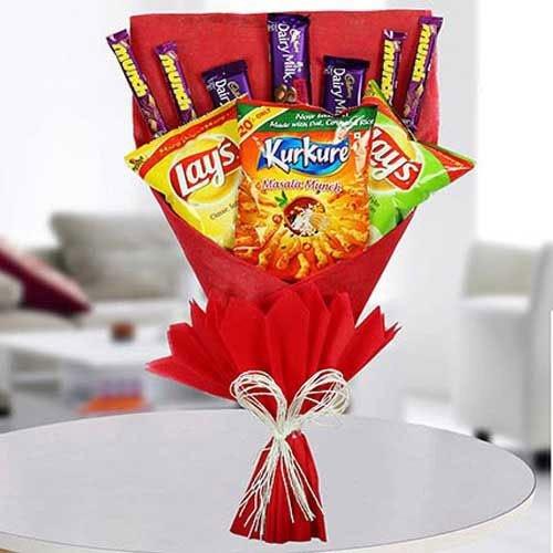 Snack bouquet with Lay's, Kurkure, and Dairy Milk chocolates wrapped in red paper 