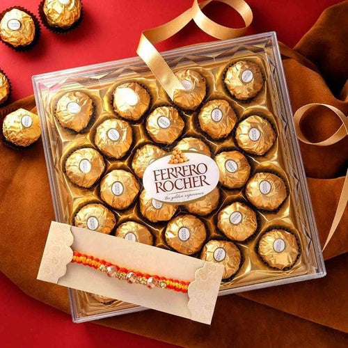 Box of Ferrero Rocher chocolates with a Rakhi on a red and brown background