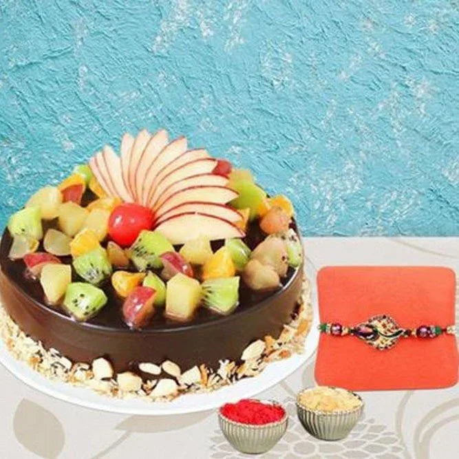 Fruit cake with a Rakhi on a blue textured background