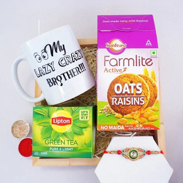 Gift basket with mug, tea, and snacks on a white background