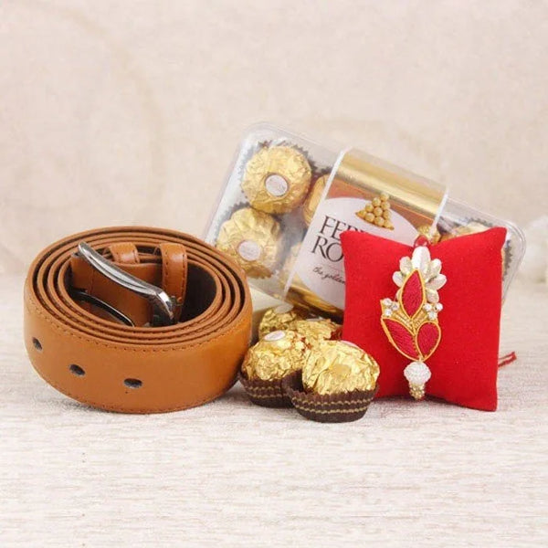 Brown belt, Ferrero Rocher chocolates, and a decorative item on a beige surface