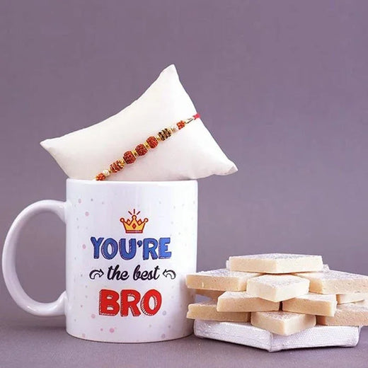 Mug with 'You're the best BRO' text, rakhi, and cookies on a purple background