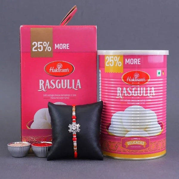 Haldiram's Rasgulla packaging with a black pouch and decorative item on a gray background