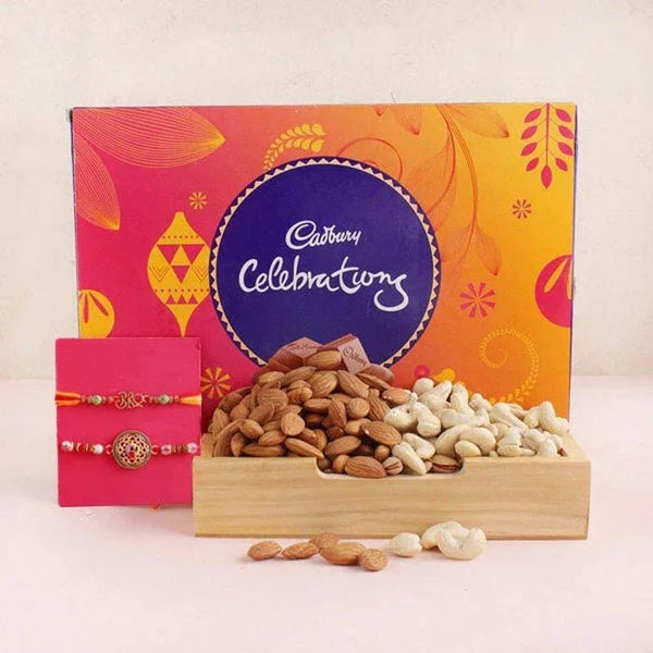 Cadbury Celebrations chocolate box with dry fruits and a pink card on a white background