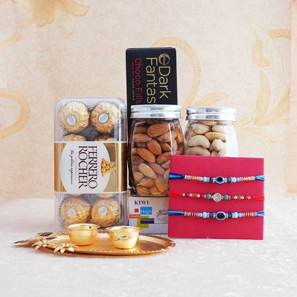 Assorted snacks and Rakhi on a decorative tray with a soft background