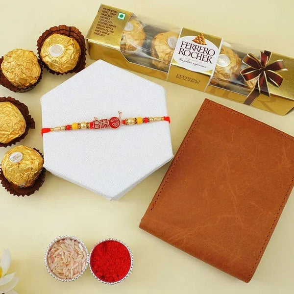 Ferrero Rocher chocolates, a leather notebook, and a Rakhi on a light background
