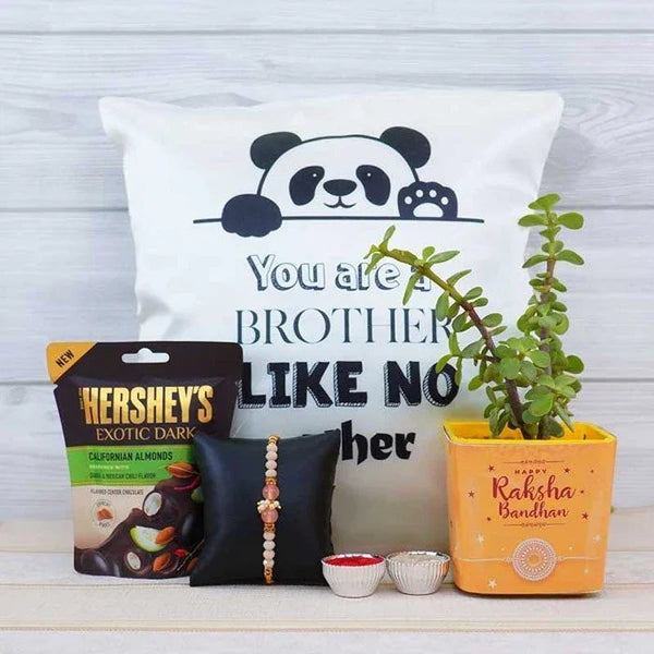 Decorative items including a pillow with a panda design, Hershey's chocolate, a plant, and a Rakhi on a wooden surface.