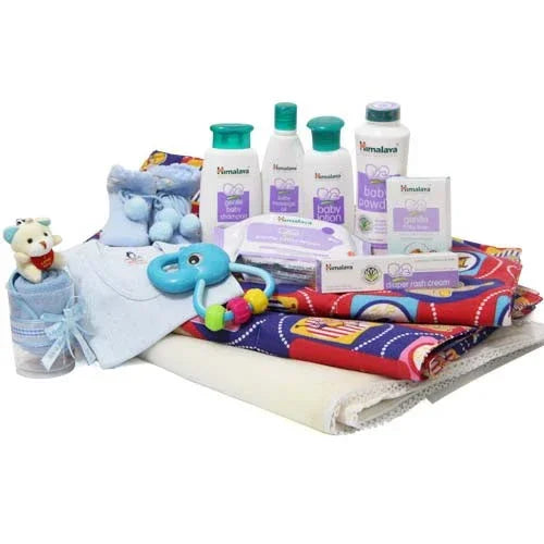 Baby gift hamper with blankets, toys, baby care toiletries, socks, clothes and washcloth