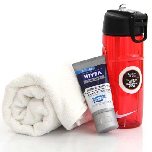 Men's gift set with white towel, Nivea face cream, and red sports water bottle