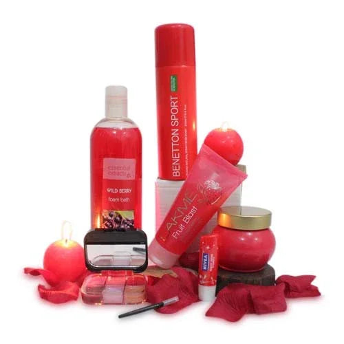 Gift set with red bath foam, Benetton Sport spray, candles, lip balm, makeup kit, and accessories