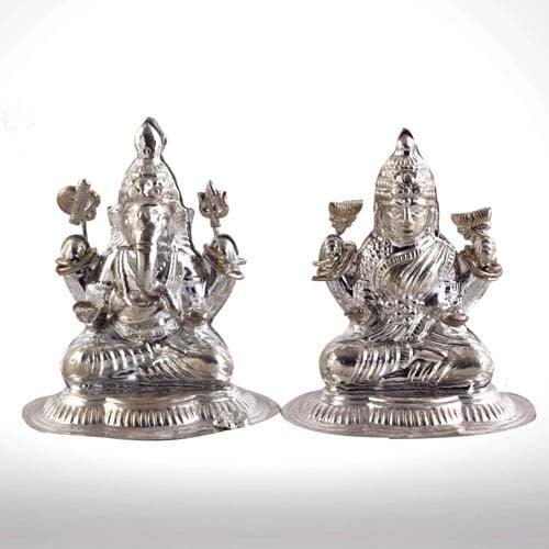 Two silver神像 statues on a white background