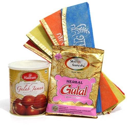 Indian festival gift set with herbal gulal, gulab jamun sweets, and colorful cloths