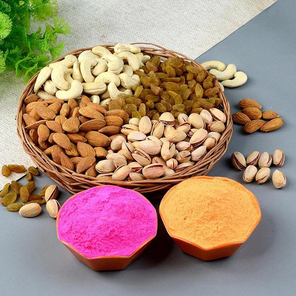 Basket of assorted nuts and seeds with two colorful containers on a light surface.