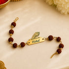 Personalized Peacock Feather Name Rakhi with Rudraksha & Evil Eye Beads customer review image