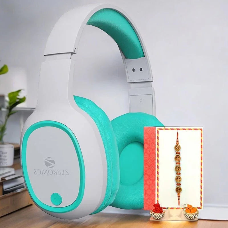 White and teal headphones with a small card featuring a Rakhi on a white background