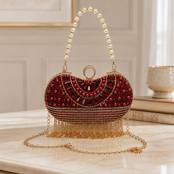 Decorative handbag with red beads and gold chain 
