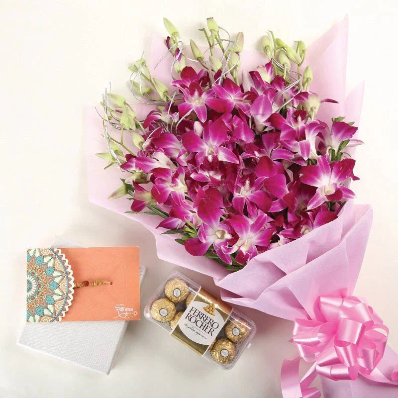 Bouquet of pink orchids with a Ferrero Rocher chocolate box and a card on a white background