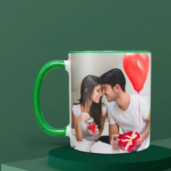 Mug with a printed photo of a couple holding a heart-shaped gift on a green background