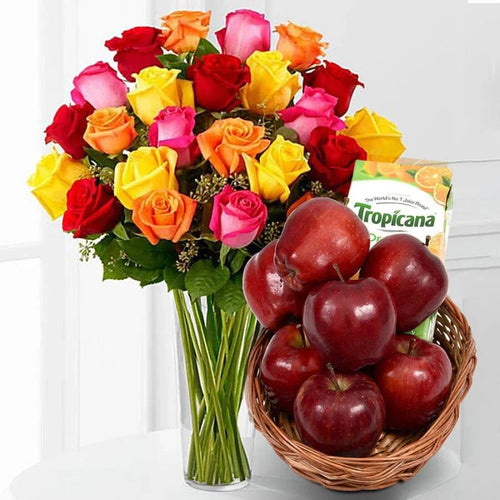 Bouquet of colorful roses and a basket of red apples with a Tropicana juice box on a white background.