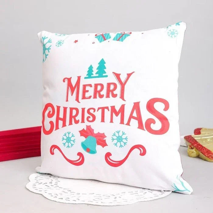 Decorative pillow with 'Merry Christmas' text and festive designs on a light gray background.