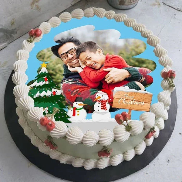Personalized Christmas cake with a photo of a man and a child on top